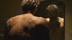 Explanation of Why Wolverine Has Scars in LOGAN and Why Johnny Cash's 