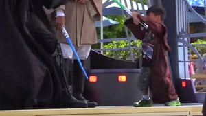 Young Padawan Boy Goes Ballistic on Darth Vader at Disneyland in Lightsaber Fight