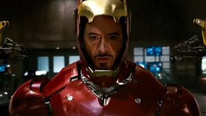 Behind the Scenes Photo of Robert Downey Jr. Trying On the IRON MAN Helmet for the First Time