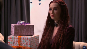 GAME OF THRONES' Melisandre Attends a Baby Shower with Seth Meyers, and It Doesn't Go Well