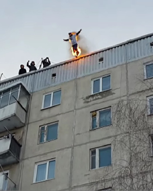 Man Performs ASSASSIN'S CREED-Style Leap of Faith Off A 100-Foot Building While On Fire