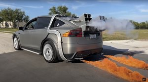 This Tesla Gets a BACK TO THE FUTURE Time Machine Makeover Complete with Fire