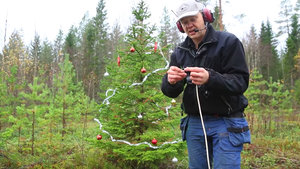 Watch a Guy Blow Up a Christmas Tree with Dynamite