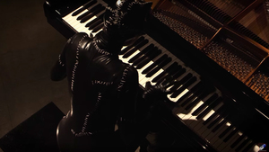 Watch: Catwoman Plays Cool Piano Cover of Danny Elfman's BATMAN Theme Song